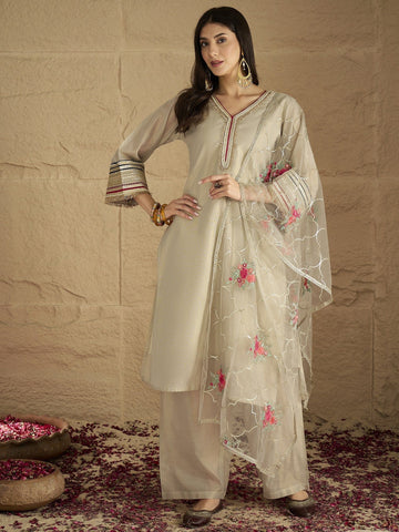Varanga Women Elegant Three-Piece Set Featuring A Shimmer-Detailed Grey Kurta, Solid Ankle-Length Trousers, And An Embroidered Net Dupatta Perfect For Festive Occasions.